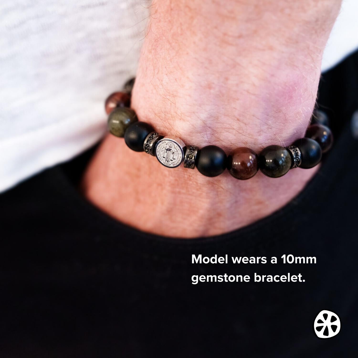 Triple Protection Hematite Cross bracelet for men and women featuring a black hematite crucifix, black matte onyx, red tiger eye, and gold sheen obsidian 10mm gemstone beads with stainless steel spacers. Handmade in the USA with tarnish-free materials and durable stretch cord. Christian religious bracelet symbolizing faith, strength, balance, and devotion. Unisex Catholic jewelry gift ideal for prayer, daily wear, confirmations, Father’s Day, and meaningful spiritual gifting.