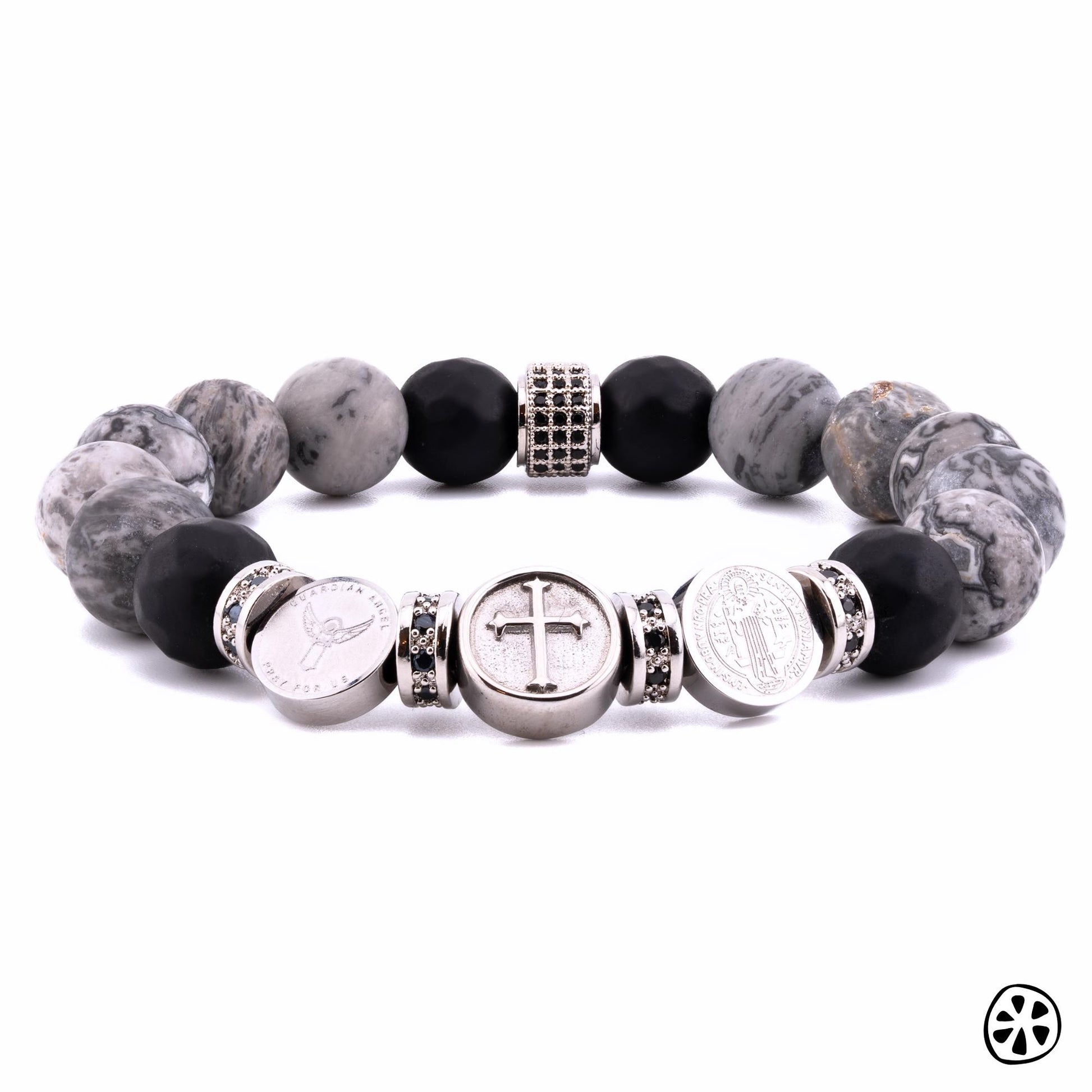 Three Saints Protection Bracelet

This powerful bracelet blends spiritual protection and grounding energy. St. Michael’s sword, Guardian Angel, St. Benedict’s medal, and the Crucifix provide divine protection, strength, and guidance. Map Jasper promotes stability and emotional balance, while Black Onyx absorbs negativity and enhances resilience. Stainless steel and brass add durability and strength, reinforcing its protective energy.