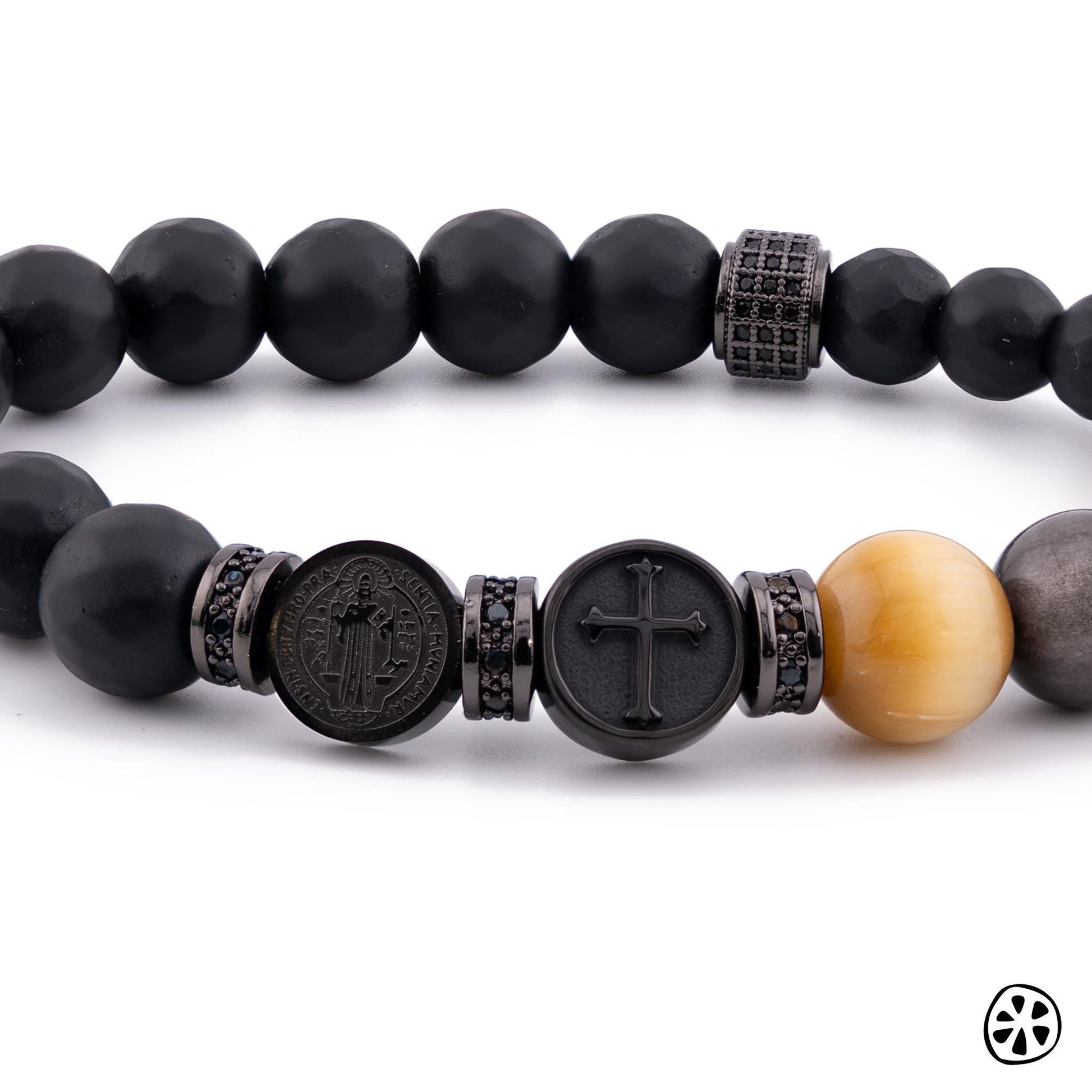 Saint Benedict Triple Protection Chaplet Rosary Bracelet for men, featuring 10mm gemstone beads in black matte onyx, golden tiger eye, and obsidian. Includes dual-sided stainless steel St. Benedict medal and cross charms in durable black PVD plated finish. Handmade contemporary Catholic men’s religious jewelry, hypoallergenic and tarnish resistant, designed for prayer, protection, and everyday wear.