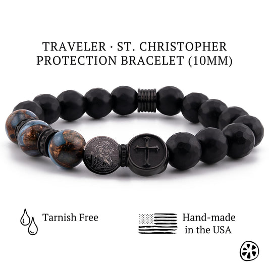 St. Christopher traveler protection bracelet for men featuring black faceted matte onyx beads and lake blue cloisonné earth-inspired beads. Handmade Catholic bracelet with dual-sided St. Christopher medal and cross charm in tarnish-free black PVD stainless steel. 10mm beads on stretch cord, masculine faith jewelry designed for protection, guidance, and safe travels. Handcrafted in the USA.