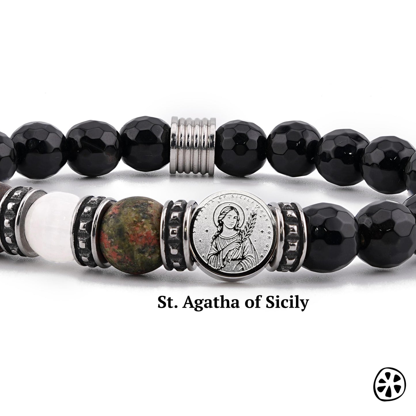 Close-up of a St. Agatha of Sicily protection bracelet featuring a dual-sided stainless steel saint charm surrounded by 8mm faceted black onyx beads and natural gemstones, including selenite and unakite. Tarnish-free stainless steel accents add durability and shine. Displayed on a clean white background, this handmade Catholic bracelet highlights its premium materials and spiritual devotional design.