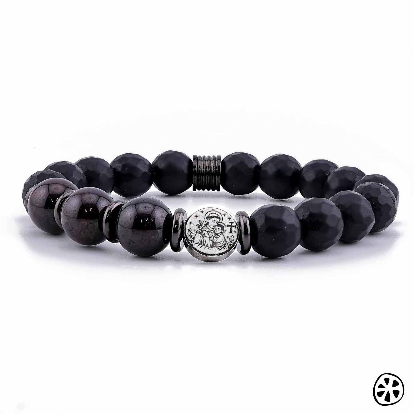 Front-facing product photo of a handmade St. Anthony of Padua bracelet featuring 10mm Black Faceted Onyx and deep Garnet gemstone beads. The stainless steel double-sided St. Anthony medal is centered between polished spacers, highlighting its engraved detail. Displayed on a clean white background, this unisex Catholic protection bracelet showcases premium craftsmanship, spiritual symbolism, and elegant gemstone design.