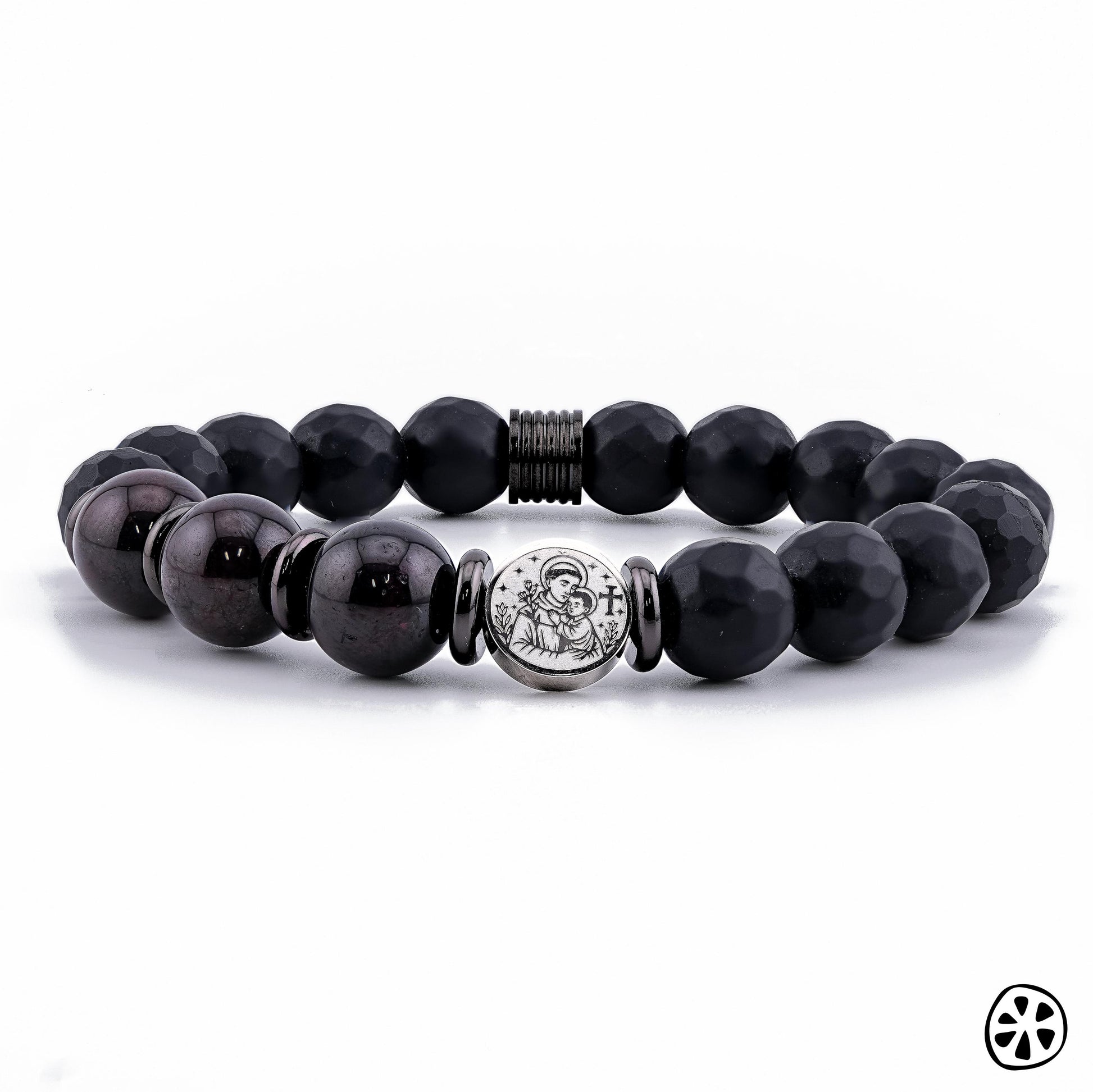 Front-facing product photo of a handmade St. Anthony of Padua bracelet featuring 10mm Black Faceted Onyx and deep Garnet gemstone beads. The stainless steel double-sided St. Anthony medal is centered between polished spacers, highlighting its engraved detail. Displayed on a clean white background, this unisex Catholic protection bracelet showcases premium craftsmanship, spiritual symbolism, and elegant gemstone design.