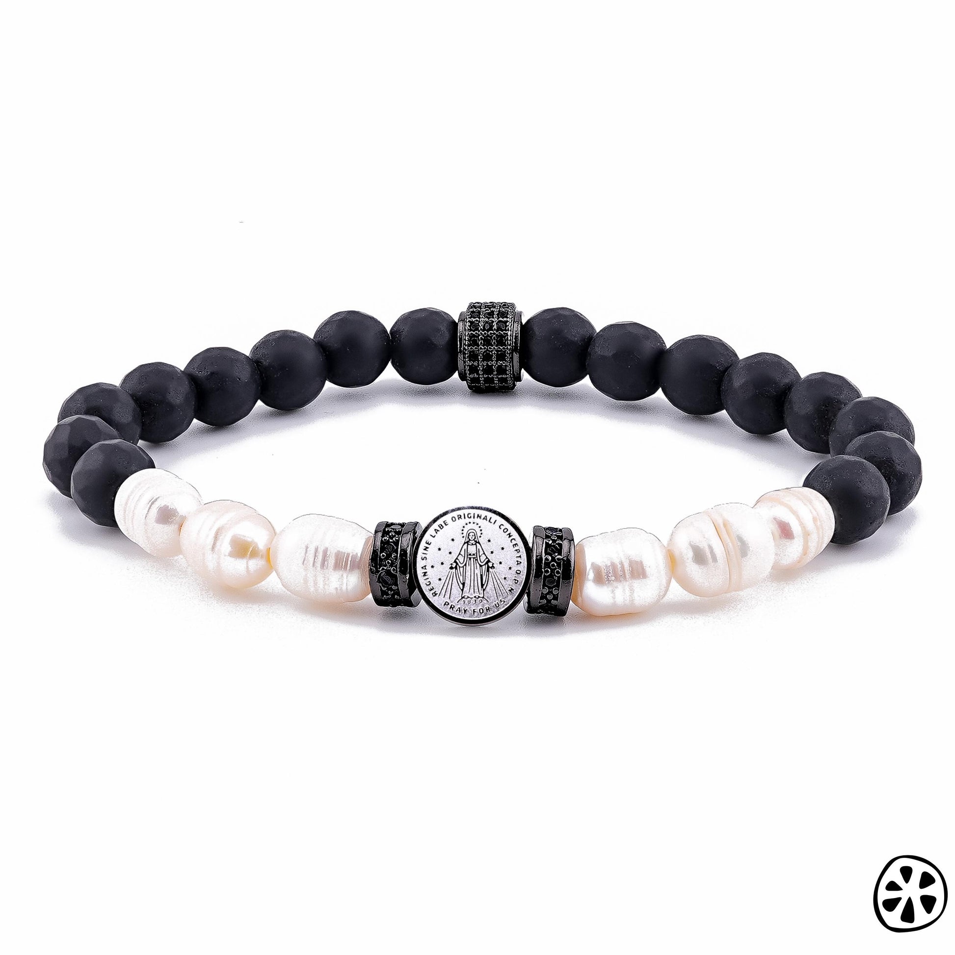 Product image of a handmade Miraculous Medal bracelet featuring matte black onyx beads paired with natural freshwater pearls and a tarnish-free stainless steel Miraculous Medal charm. The design includes black CZ-accented brass spacers and faceted onyx details. Bracelet is photographed on a clean white background with clear focus on the religious charm and gemstone textures.