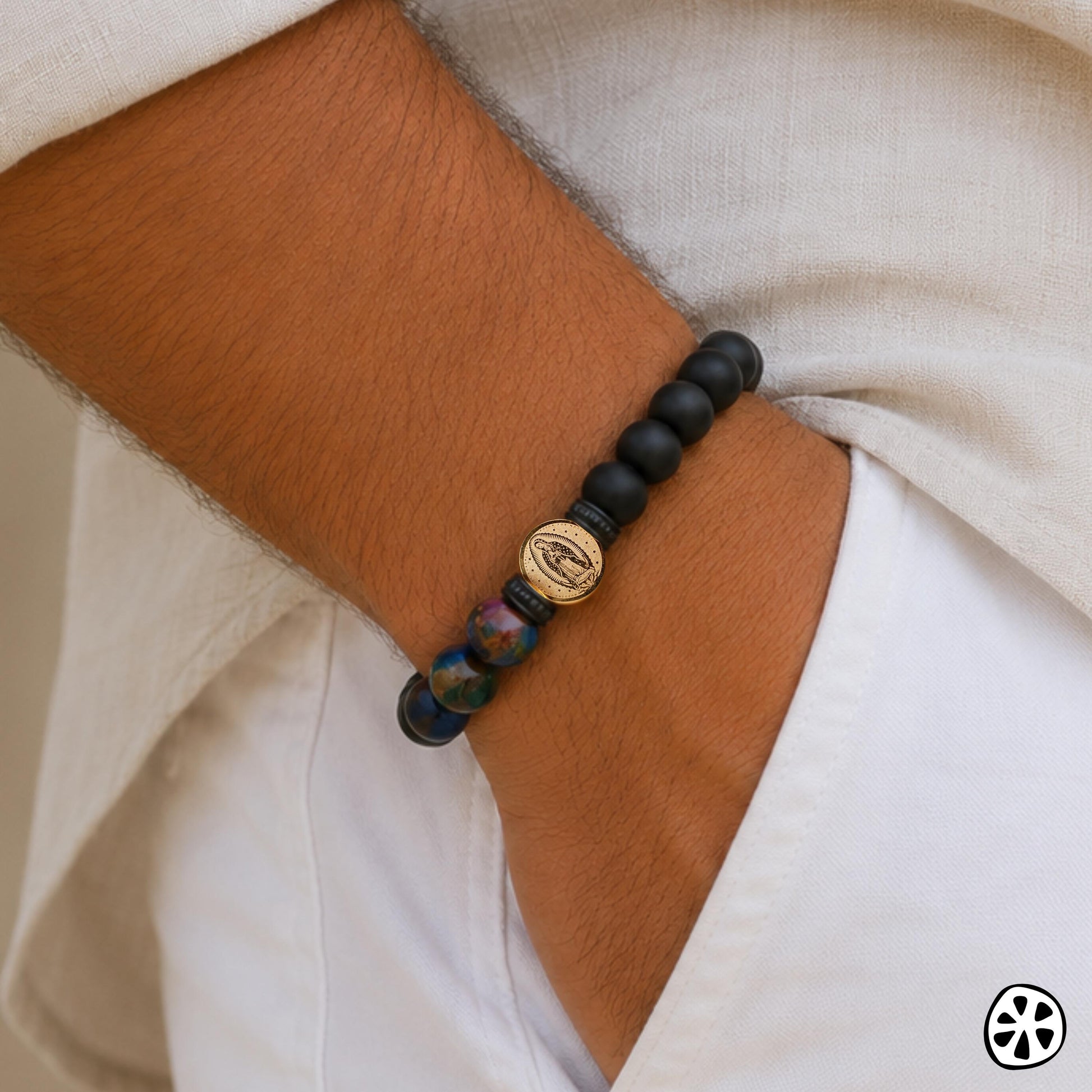Guadalupe Virgin bracelet with stainless steel 18K PVD gold plated 10mm medal, matte black onyx, and colorful cloisonné beads inspired by Our Lady of Guadalupe colors. Contemporary Catholic men’s bracelet with symbolic protection style for everyday wear. Tarnish resistant stretch bracelet gift for boyfriend, husband, dad, first responder, police officer, nurse, EMT, confirmation, Father’s Day, birthday, or faith inspired jewelry gift.